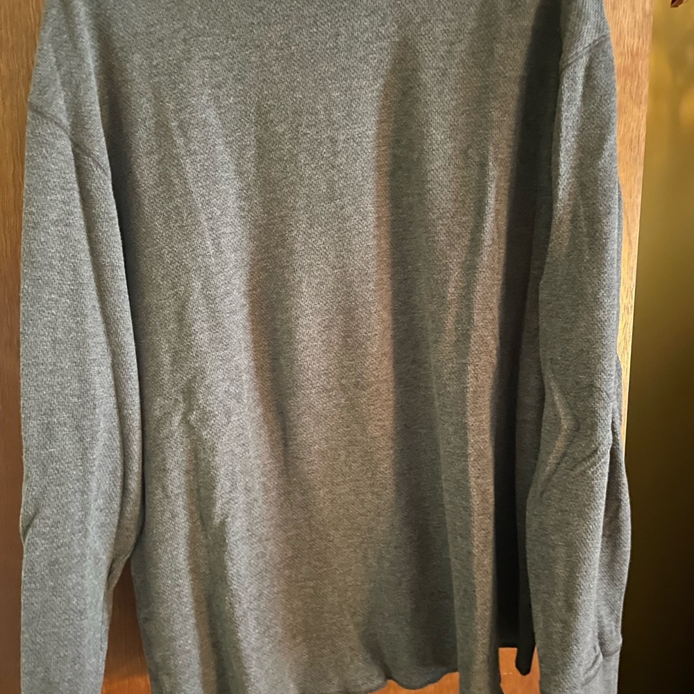 A man’s light gray thermal, long sleeve shirt